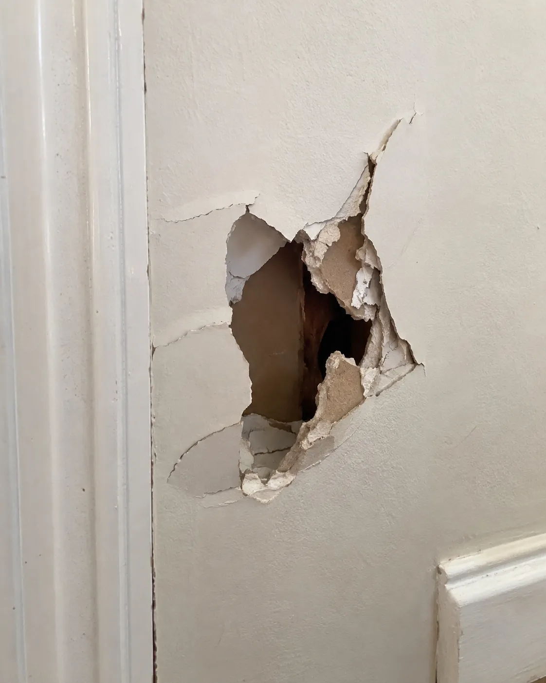 Jagged hole in drywall