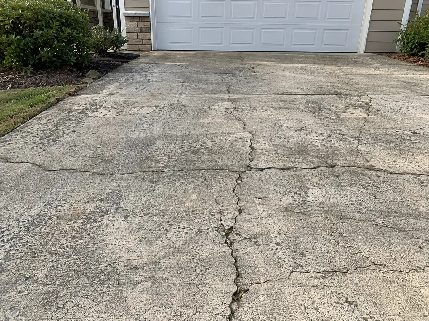 Cracked concrete driveway