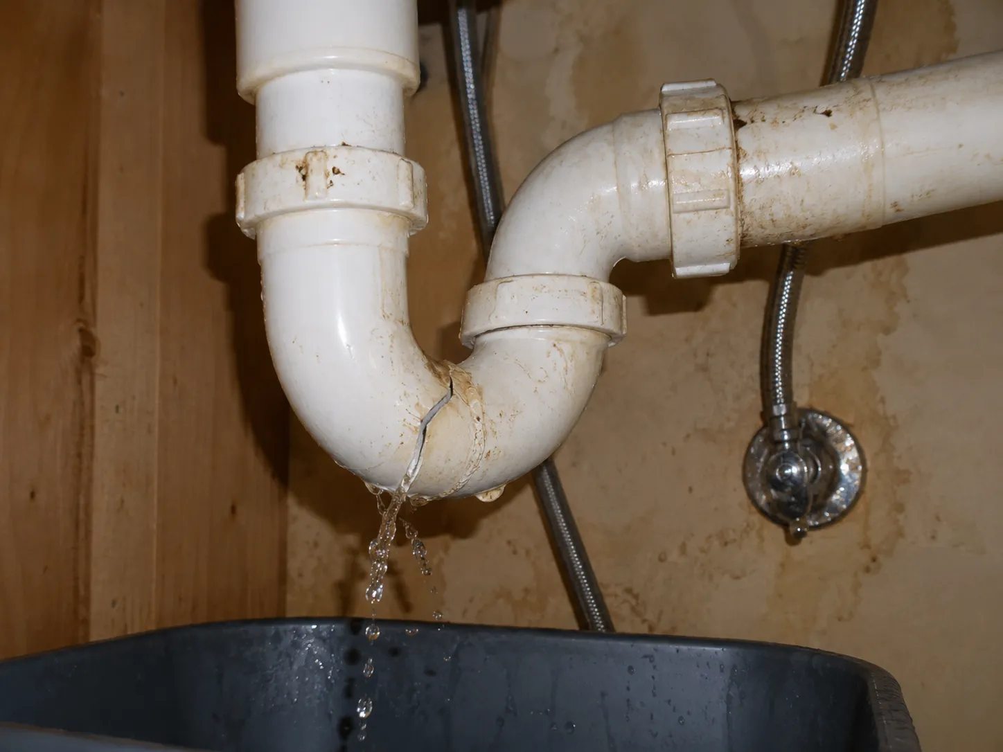 Leaking pipe under a sink